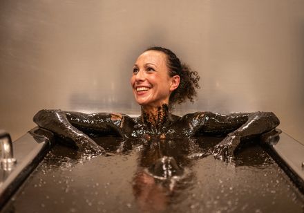 Woman in mud bath