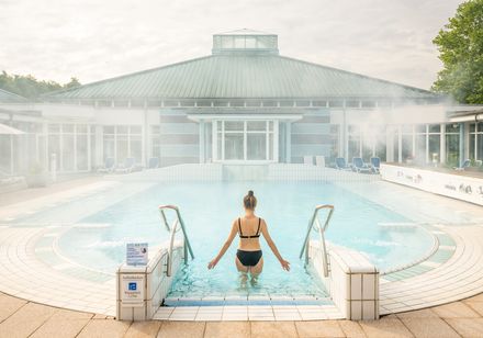 Woman entering the pool